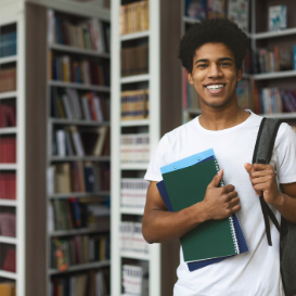 student in library