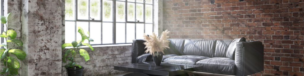 black couch in industrial style room