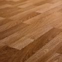 A close up of a warm toned wooden floor